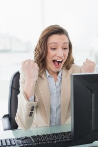 elegant-businesswoman-cheering-office-desk