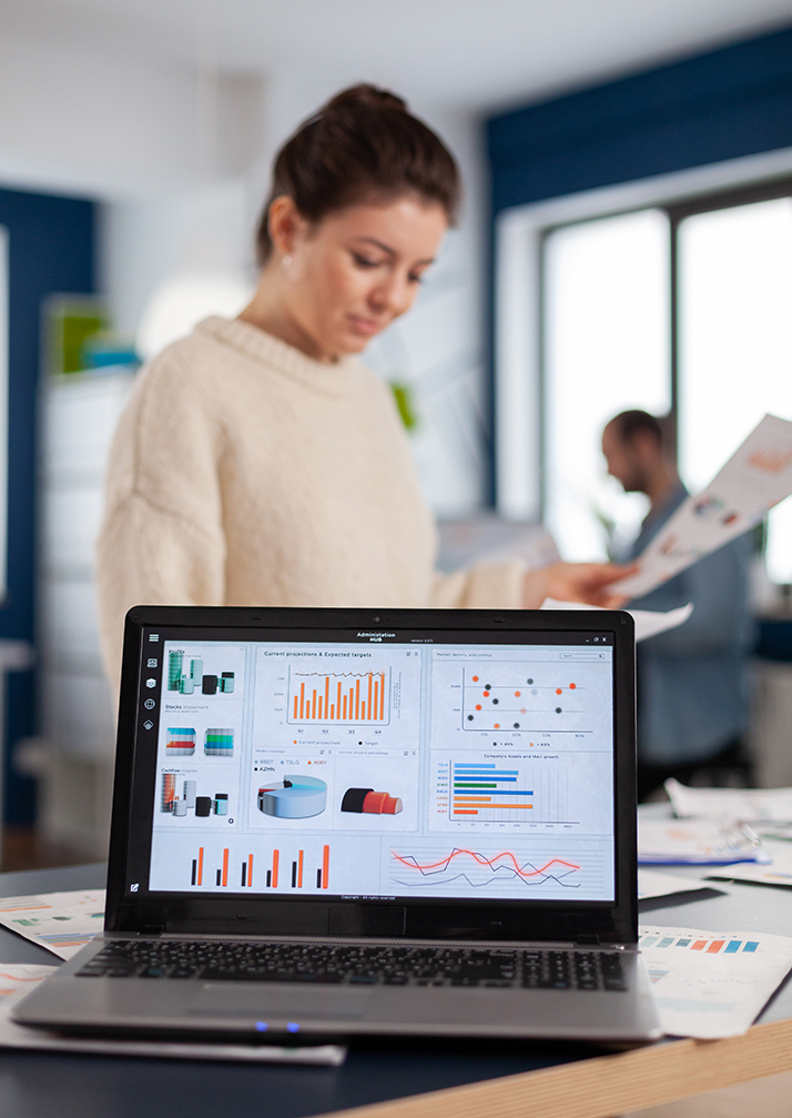 Laptop with financial charts on office of start up company
